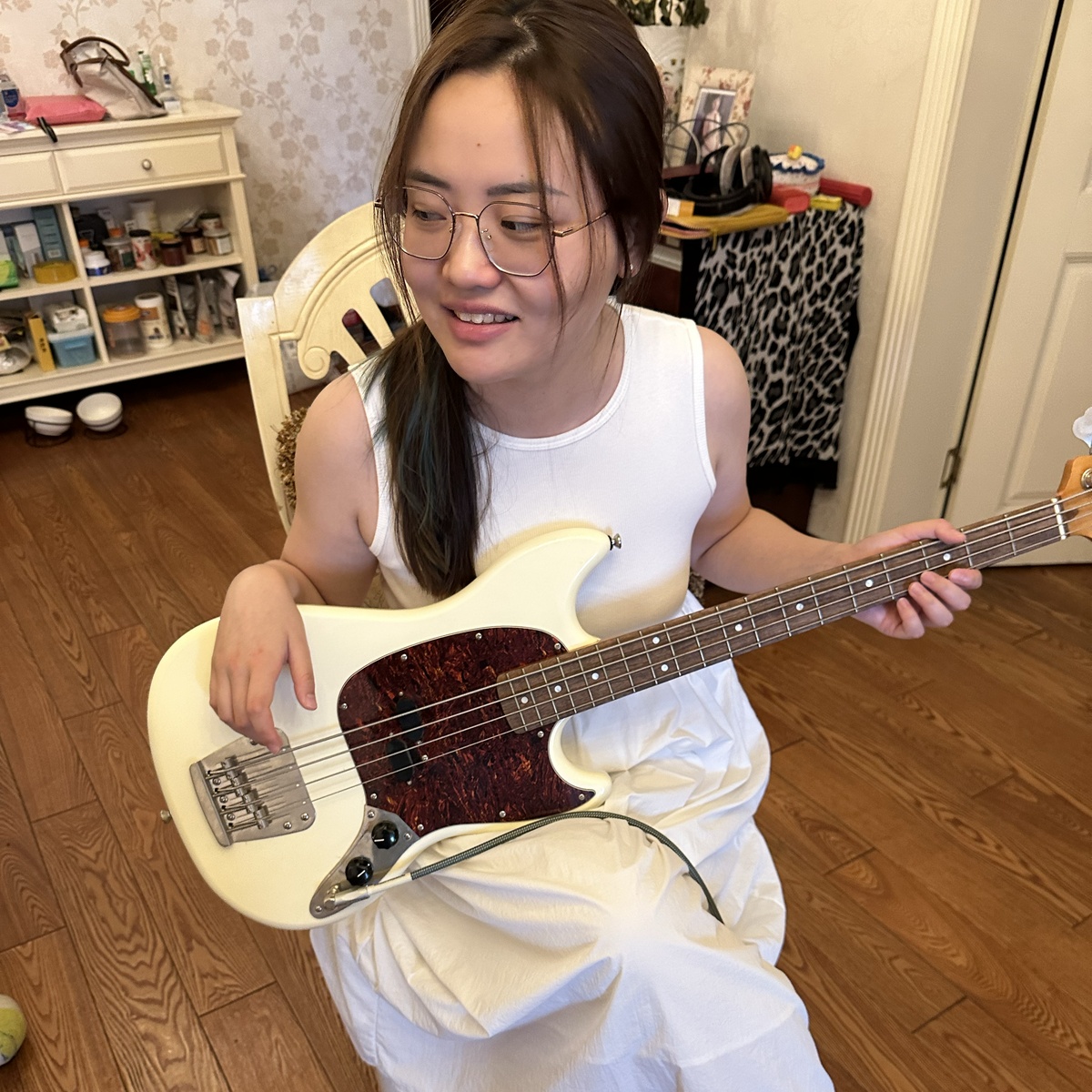 35 playing bass guitar
